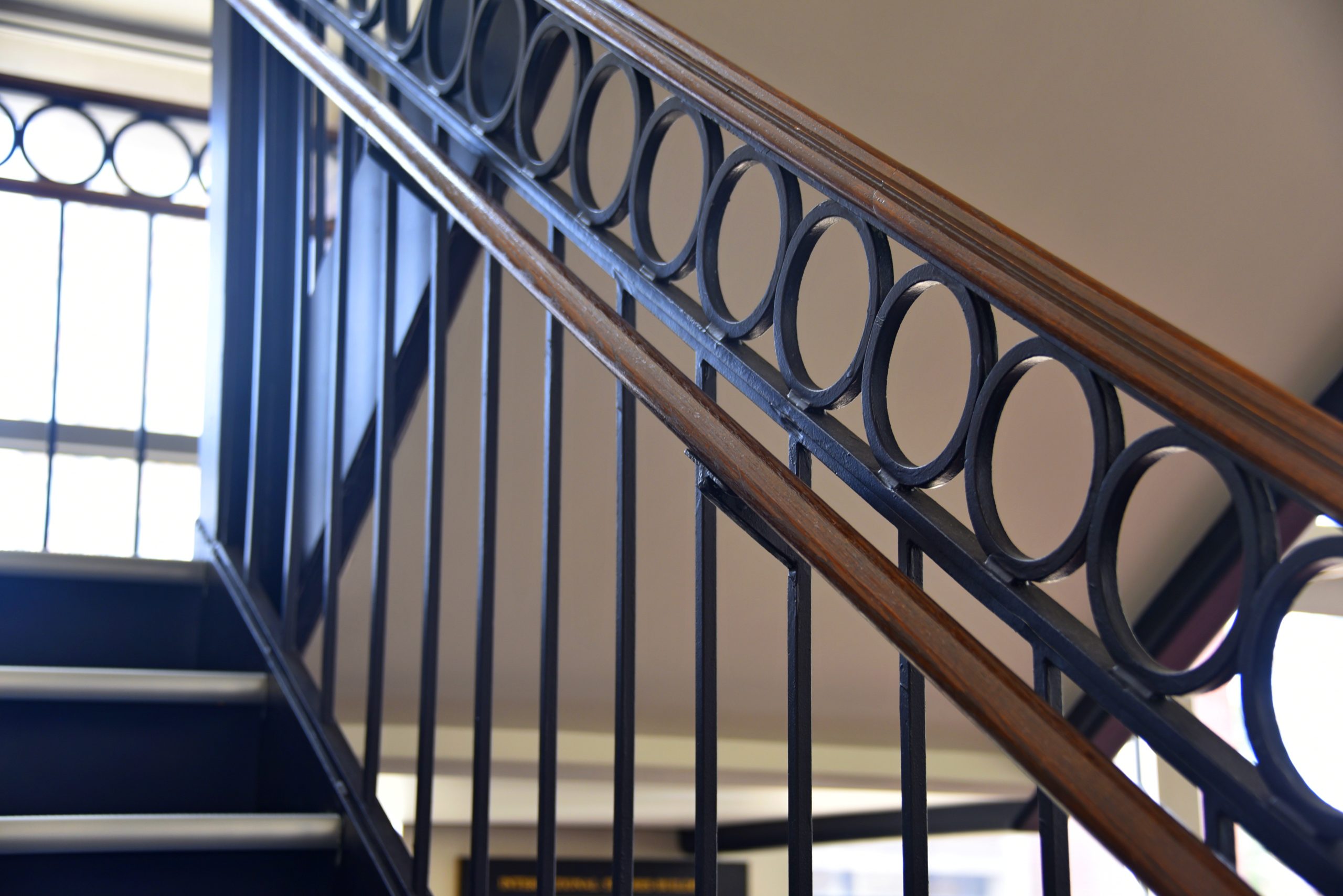 Handrail at International Studies Building with new paint, flooring