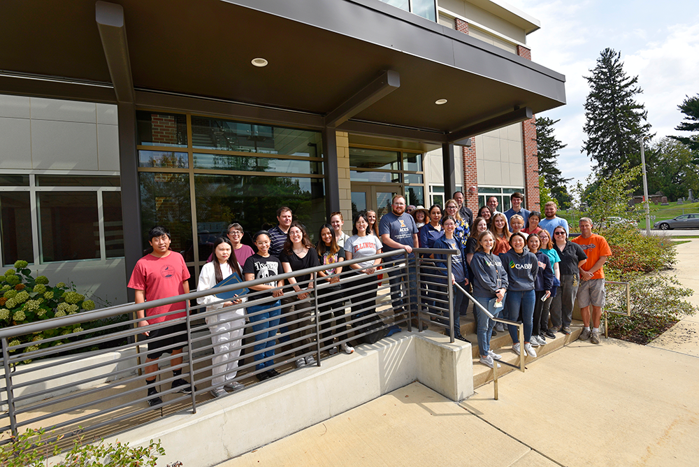 A group photo of 2023 Freezer Challenge participants in front of the Integrated Bioprocessing Laboratory