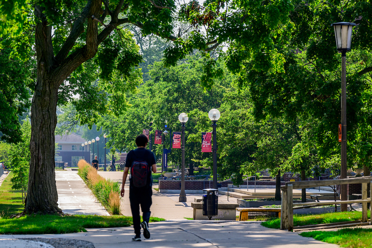 Students walk near the Carl R. Woese Institute for Genomic Biology (IGB) at the University of Illinois Urbana-Champaign. Photo taken on Wednesday, July 5, 2023. (Photo by Fred Zwicky / University of Illinois Urbana-Champaign)