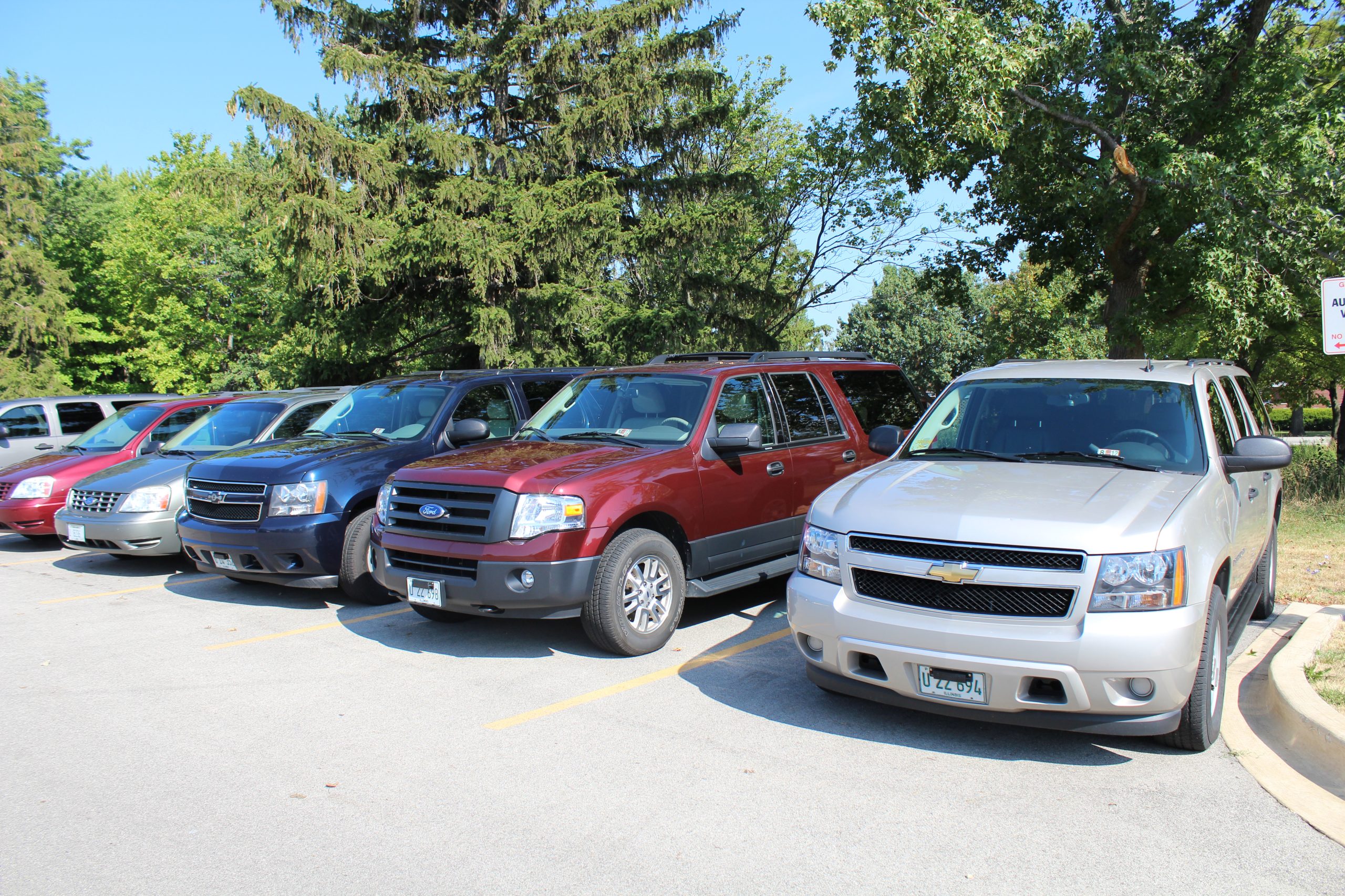 Image of line of different style vehicles at Car Pool