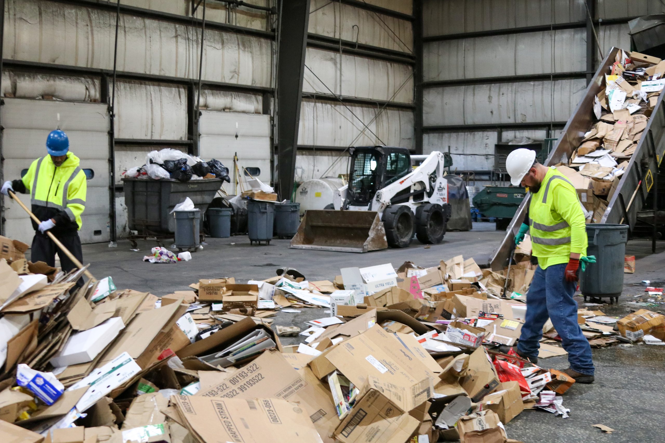 Waste Transfer Station pile of cardboard being sorted