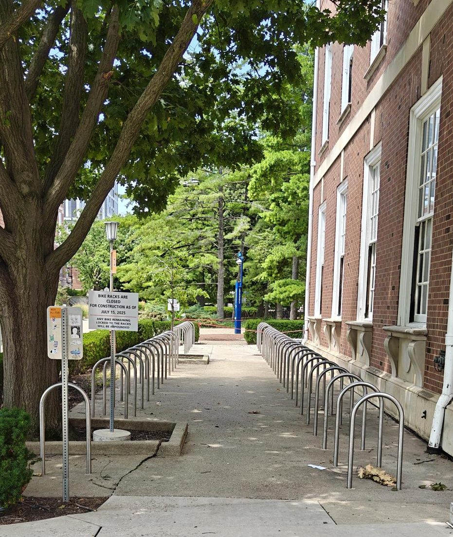 The bike rack location at the southwest corner of the Illini Union is shown from an adjacent sidewalk.