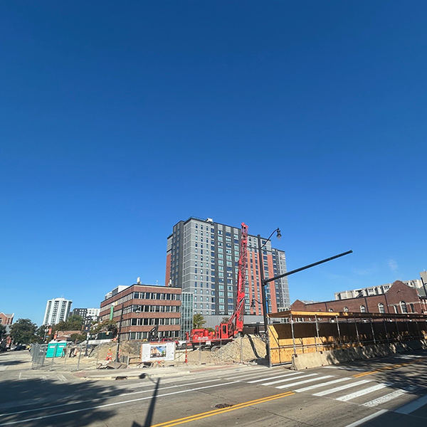 the site of the new Illini Hall from Wright St. that shows various initial construction activity