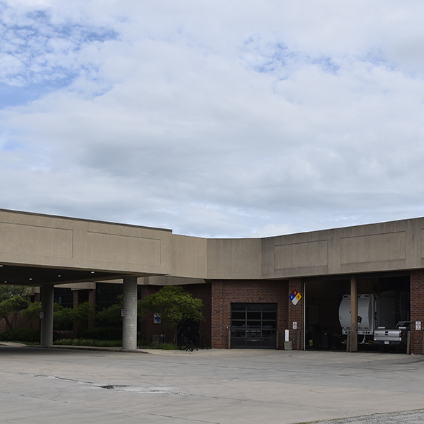 Exterior facade of the Garage and Car Pool showing the main lobby and fueling station