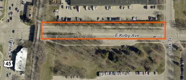 An aerial view shows a westbound lane closure on Kirby Avenue between Neil Street and South Oak Street.