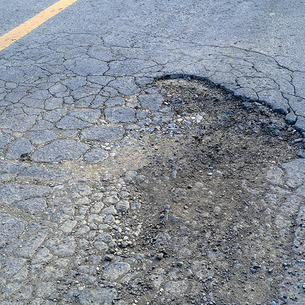 Pothole near the center line on a road